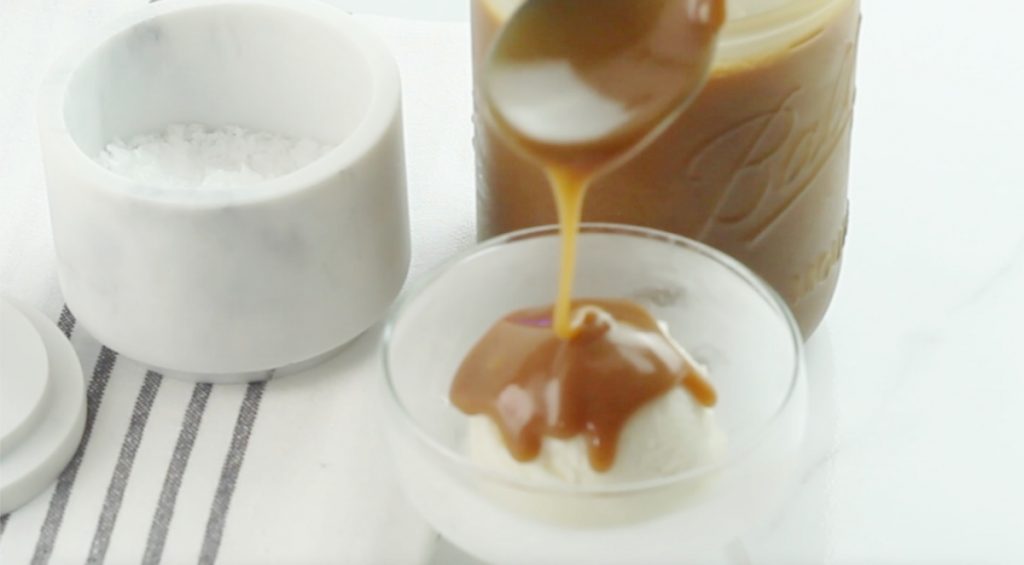 With soon pouring caramel or butterscotch sauce over vanilla ice cream.