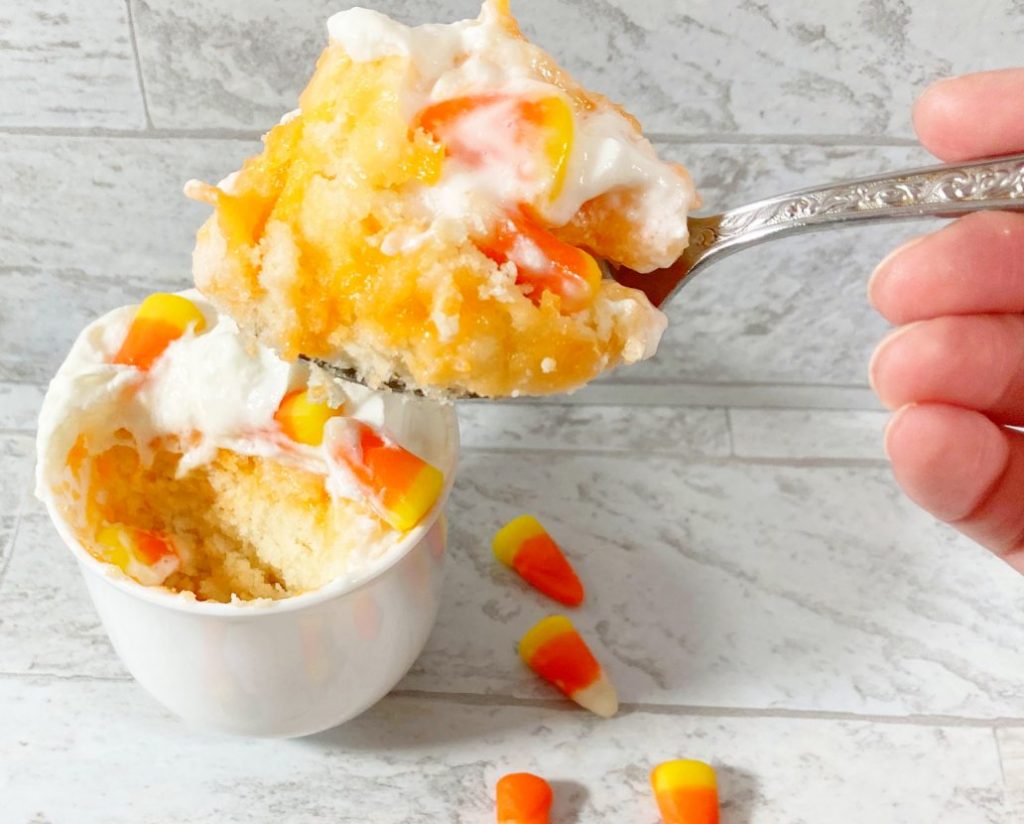 Large spoonfull of candy corn cake
