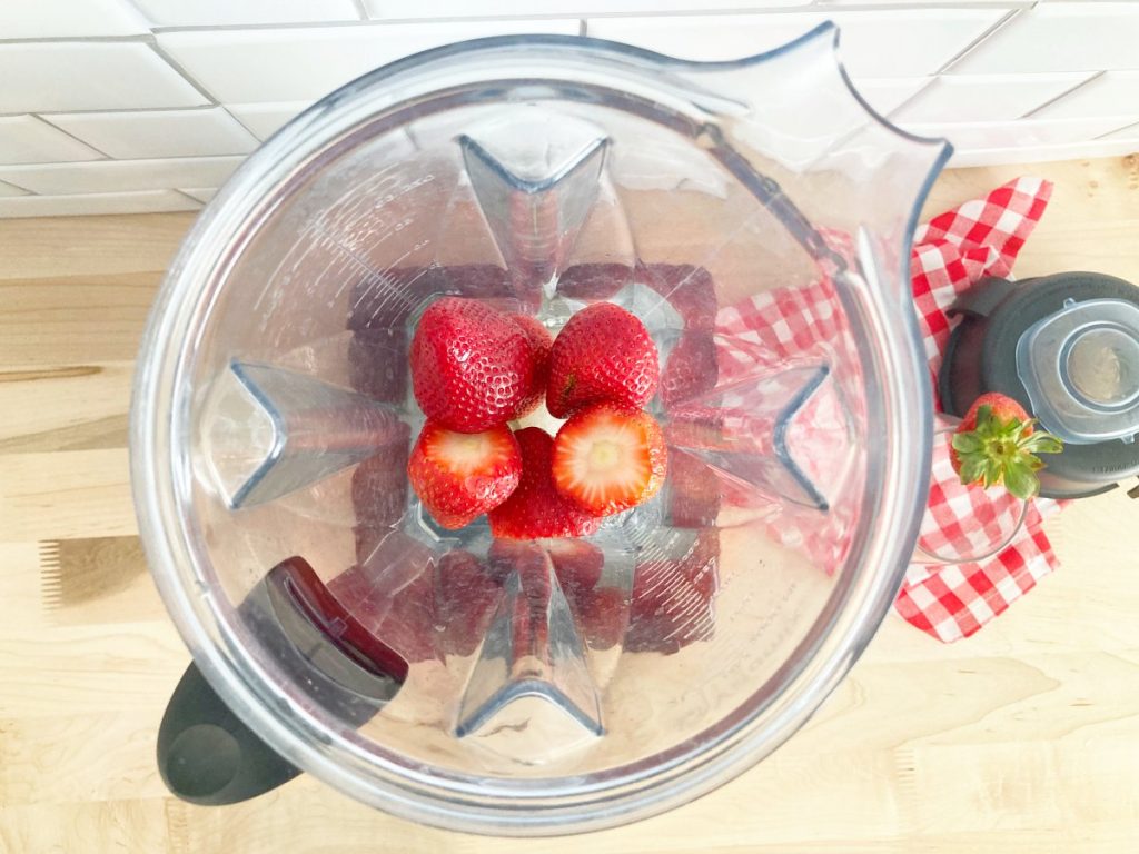Prepped stawberries in blender jar.