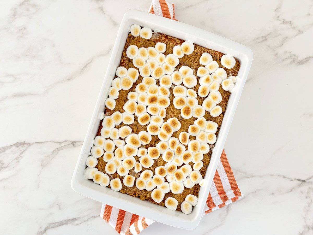 Down view baked sweet potato crumble casserole. Mini marshmallow are slightly golden brown.