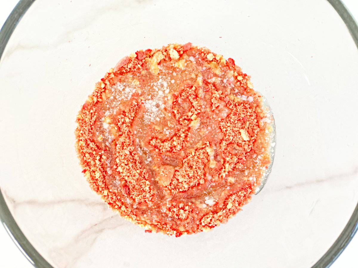 Down view topping in clear bowl with melted butter.