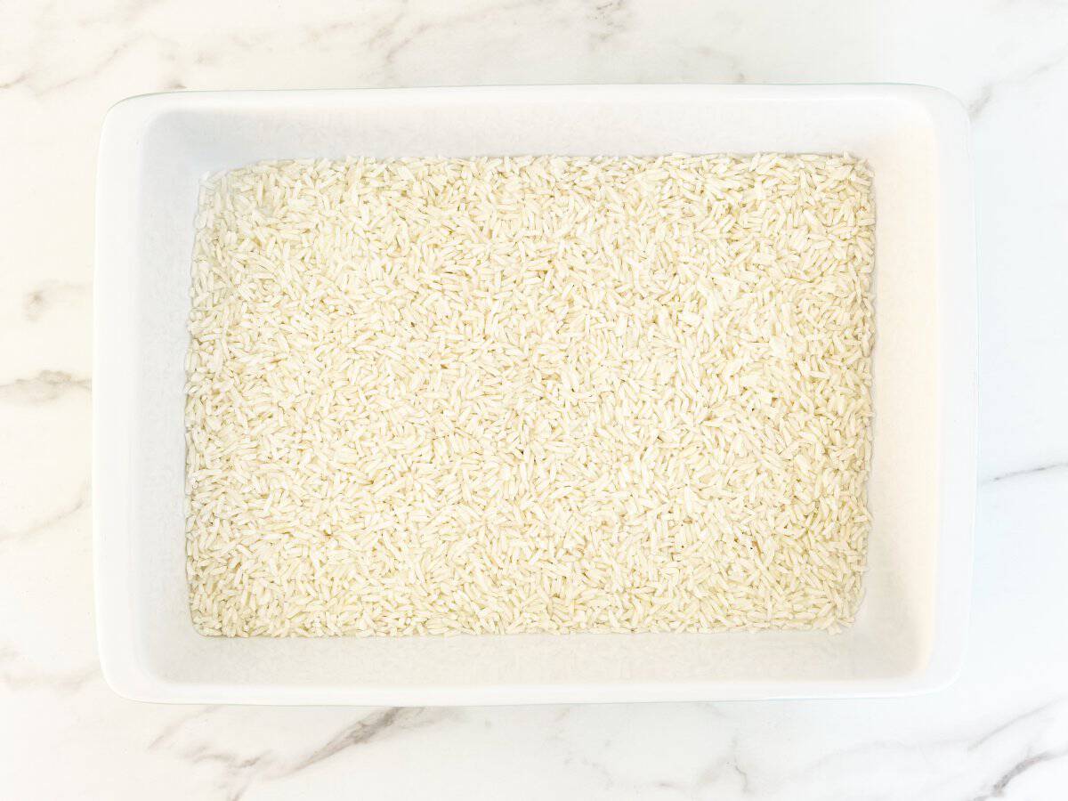 Down view white baking dish with minute rice.