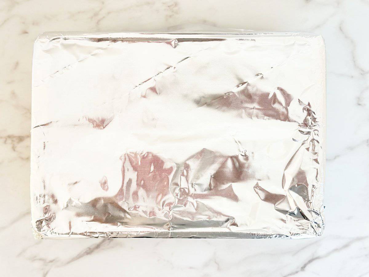 Down view of baking dish covered in foil.