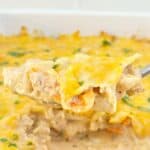 Close up view of chicken fajita casserole on silver spoon.