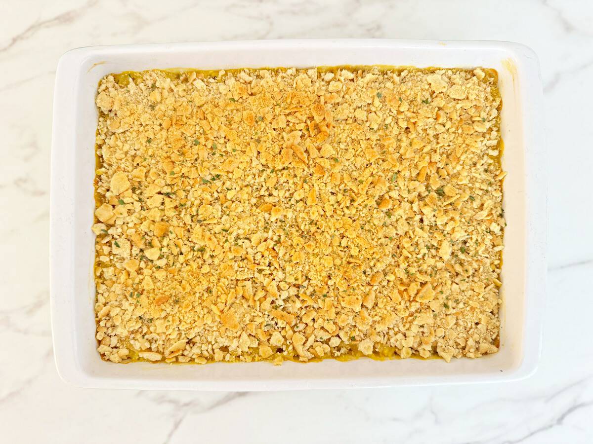 Down view white baking dish with baked casserole.