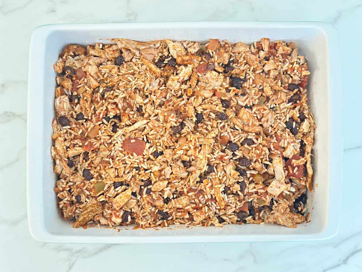 Down view white baking dish with mixed ingredients.