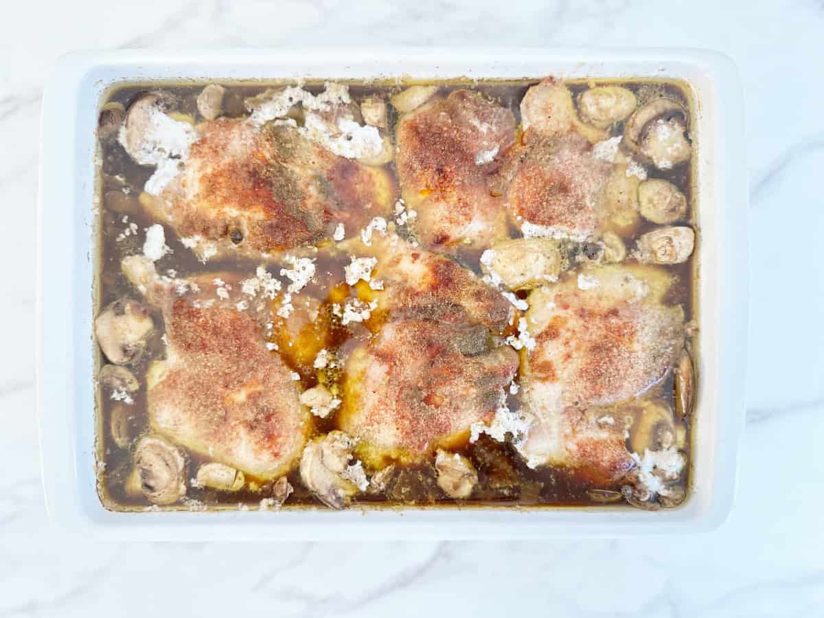 Down view white baking dish with unbaked casserole with foil removed.