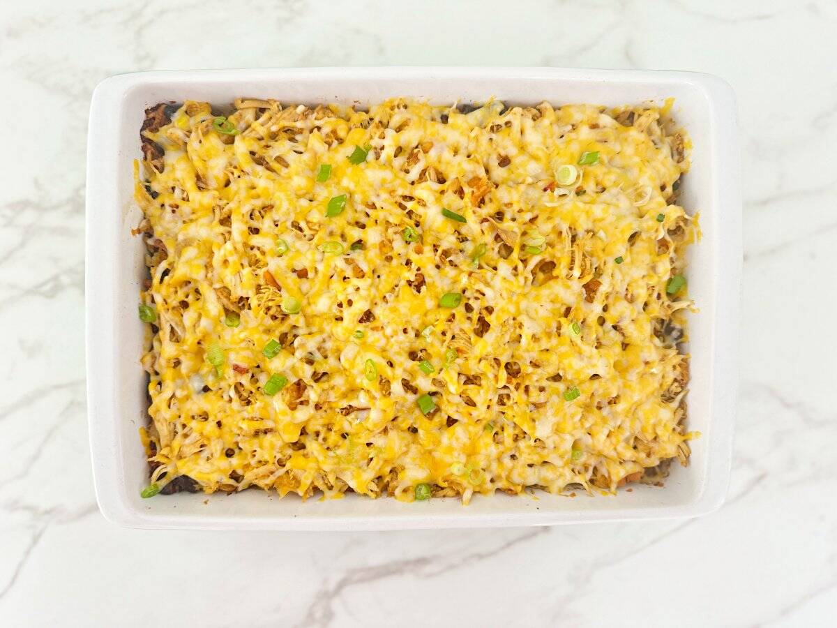Down view of baked casserole in white baking dish.