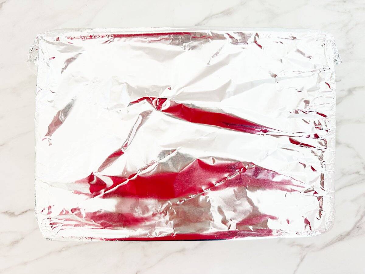 Down view of baking dish covered in foil.