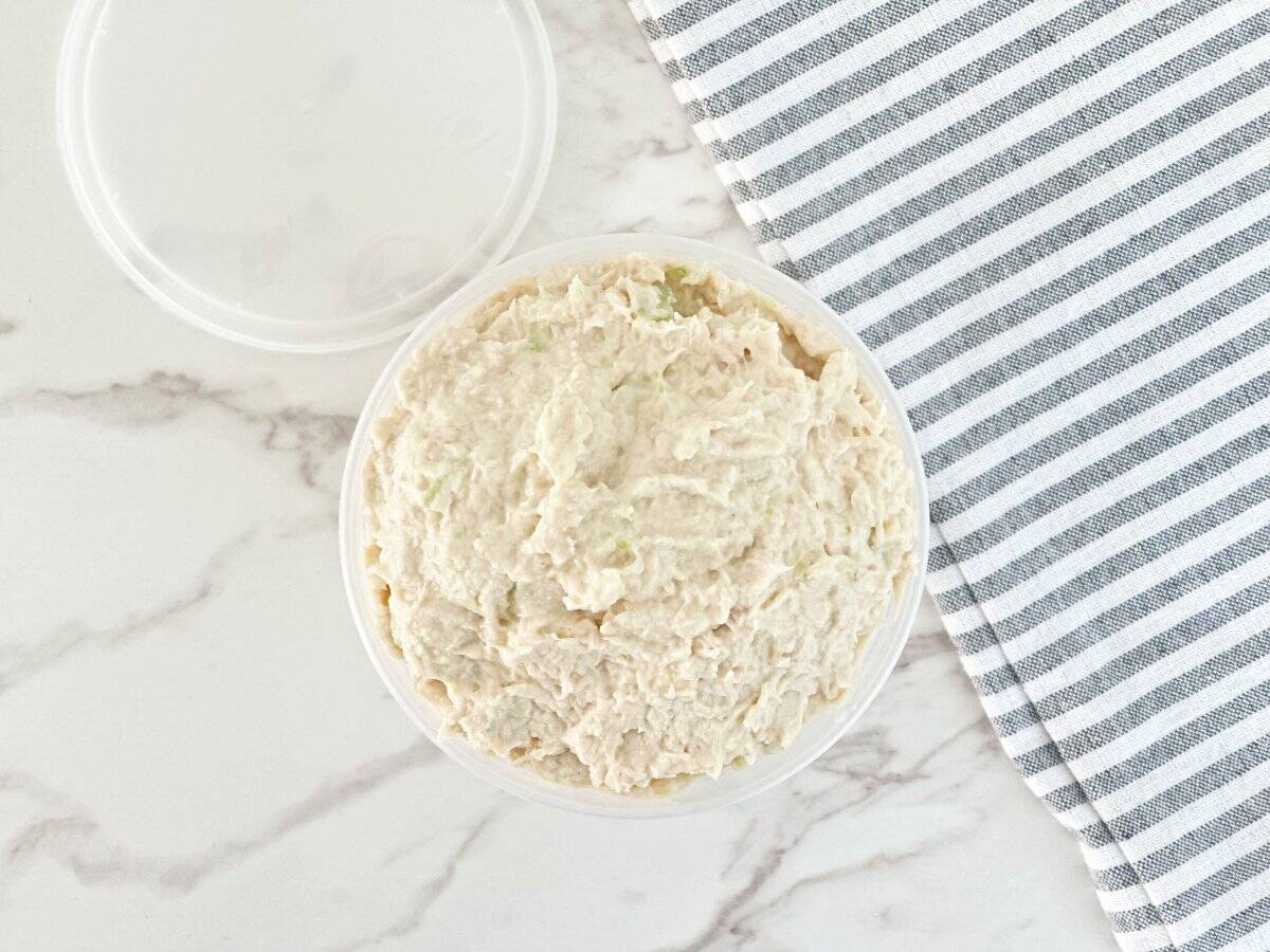 Down view of chicken salad in deli container.