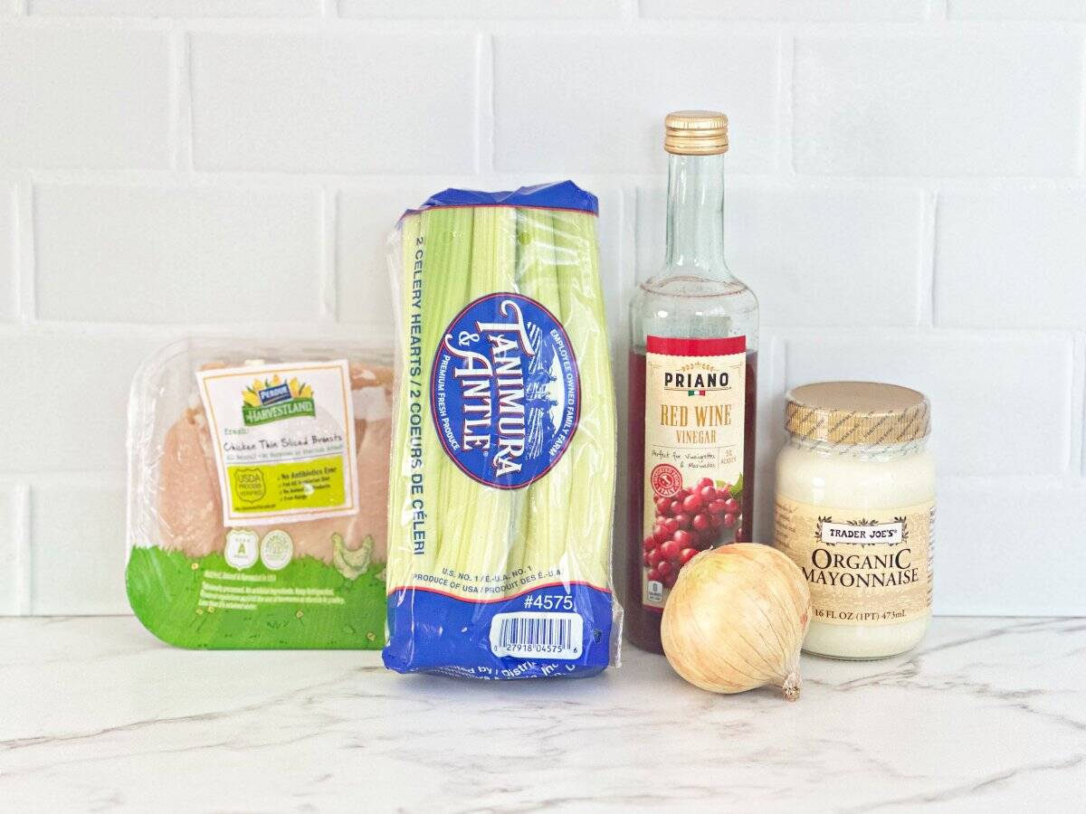 Side view of ingredients in their packaging and fresh vegetables.