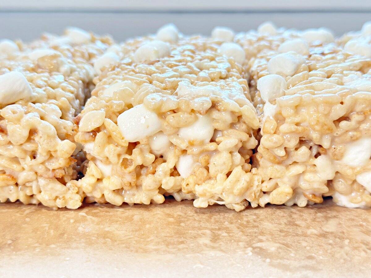 Side view of cut rice krispies treats with condensed milk.
