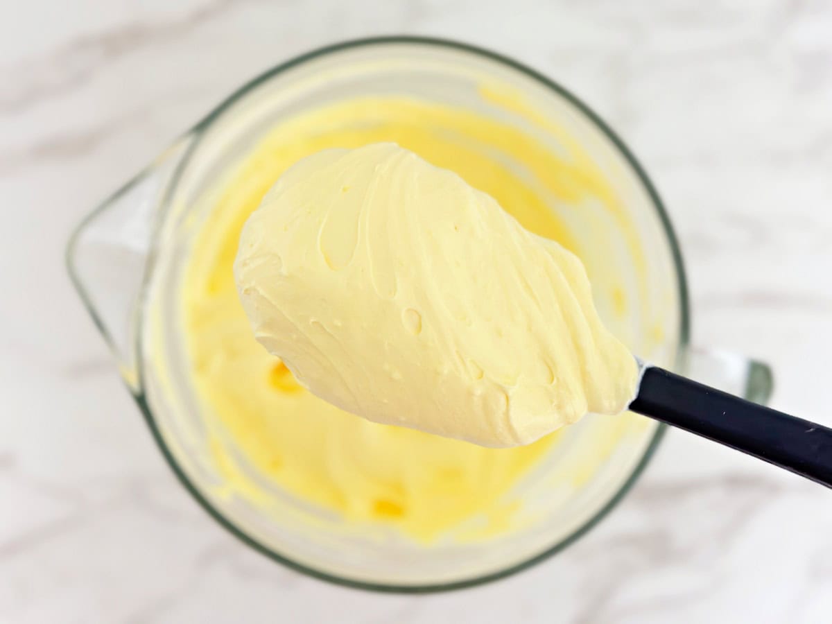 Rubber spatula with fluffy vanilla pudding.