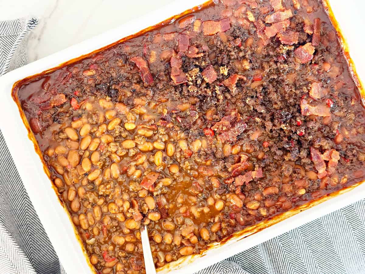 Cowboy baked beans with canned bush's baked beans in white baking dish