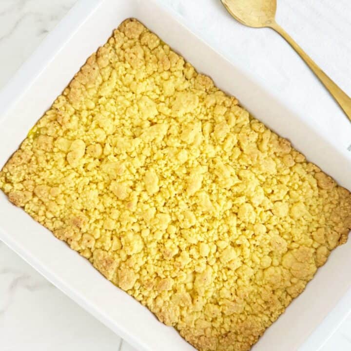 Down view of lemon crumble cobbler with cake mix in a white baking dish.