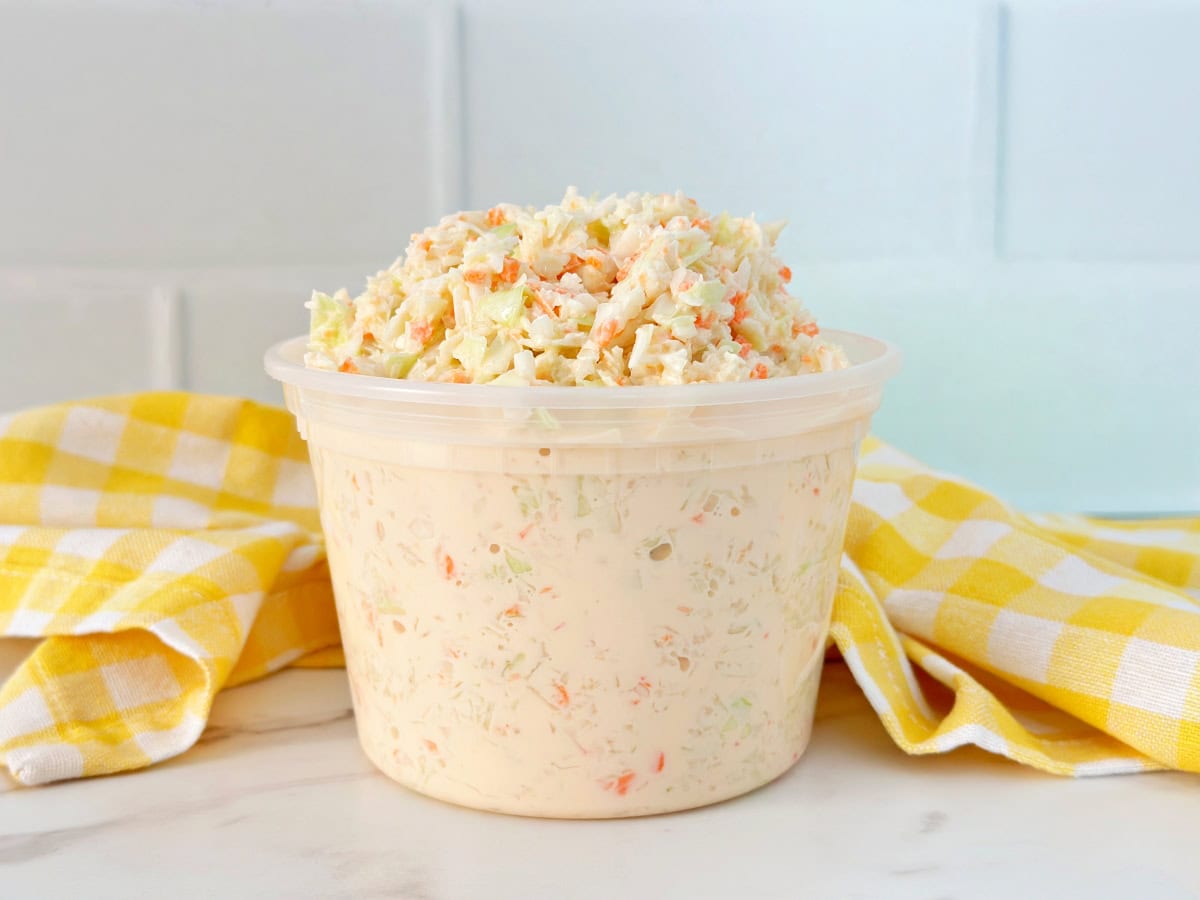 Southern coleslaw in clear deli container.