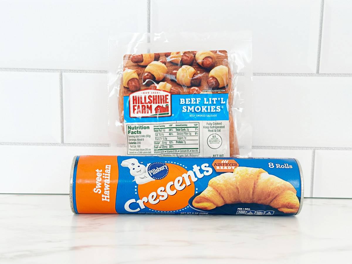 Crescent roll dough and lit'l smokes in their packaging.