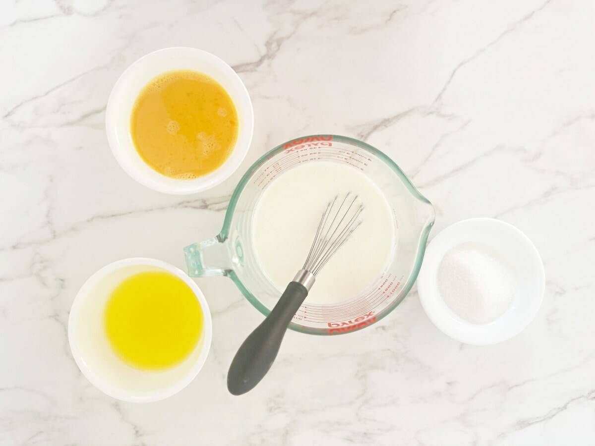 Prepped wet ingredients in bowls, down view.